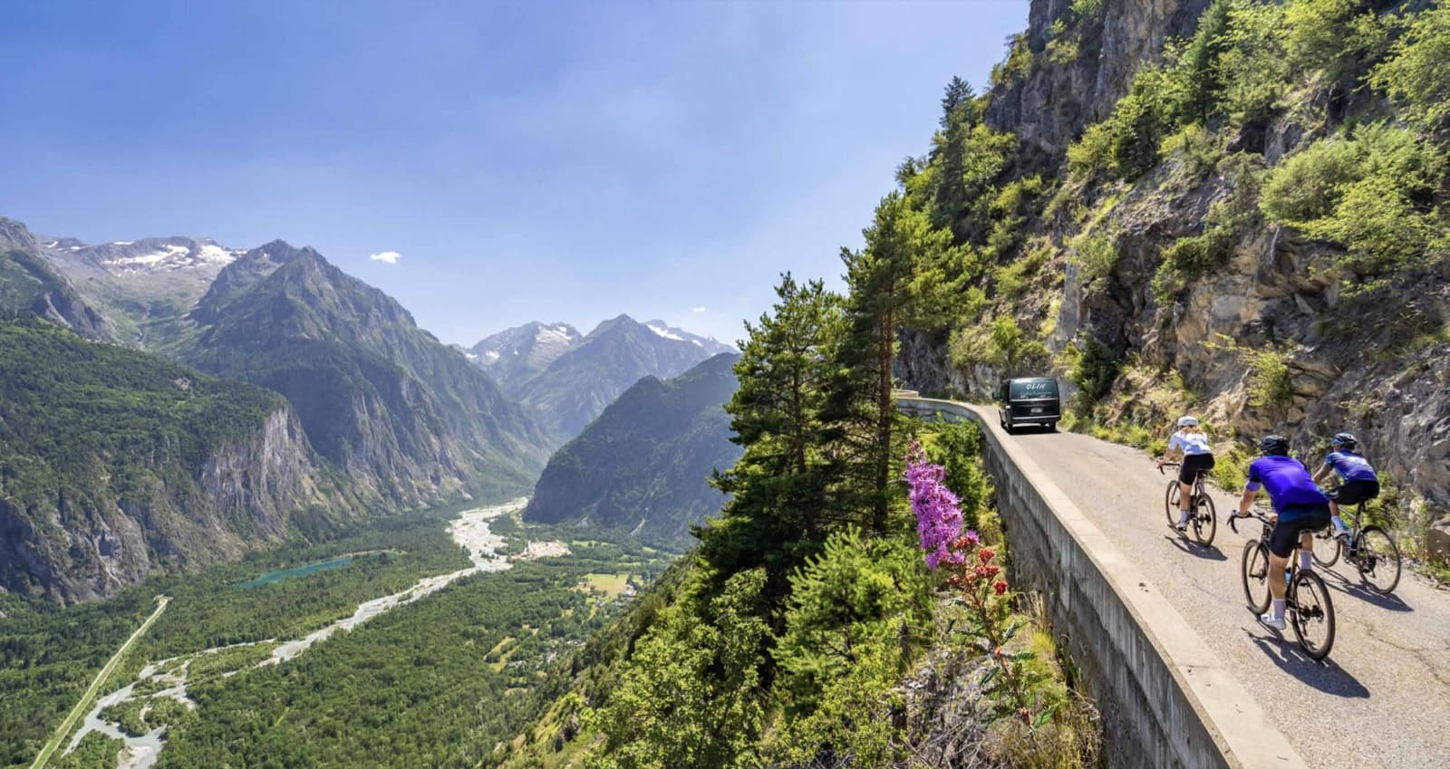 Cyclists on the Oisans valley road, French Alps