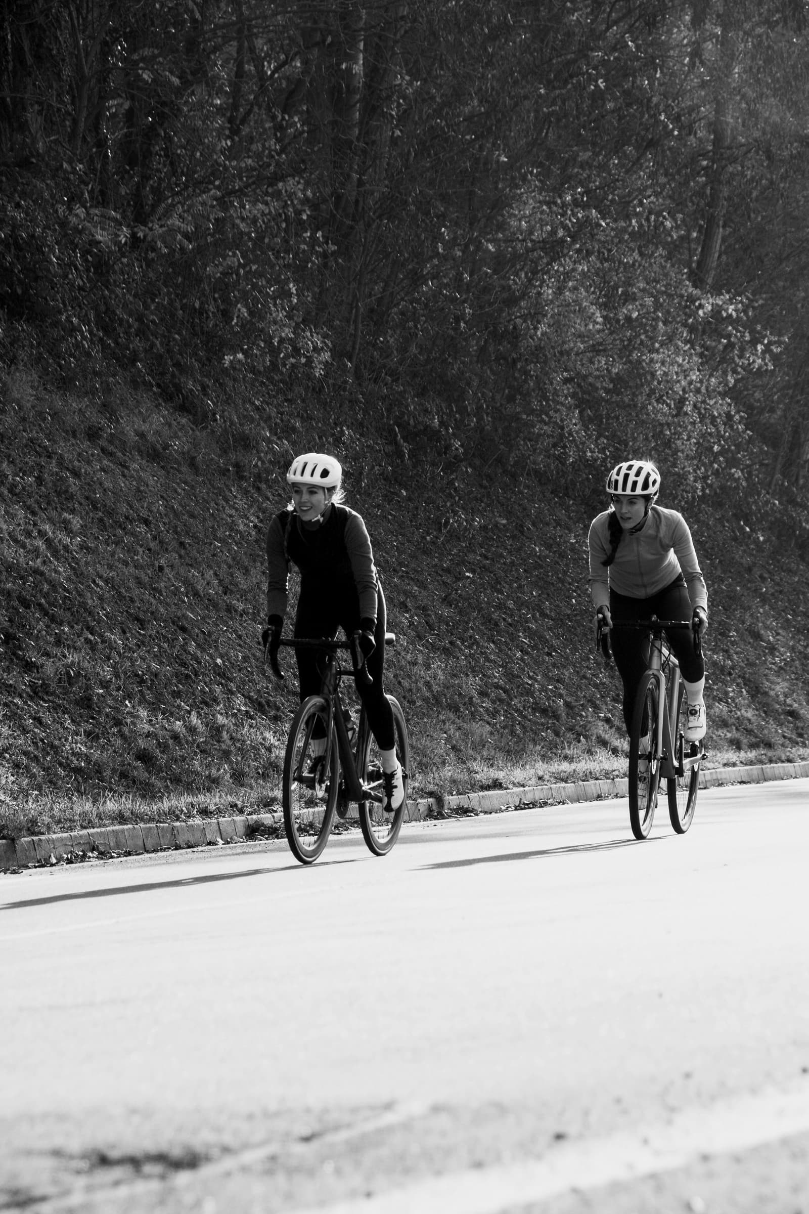 Two cyclists riding in purposeful movement